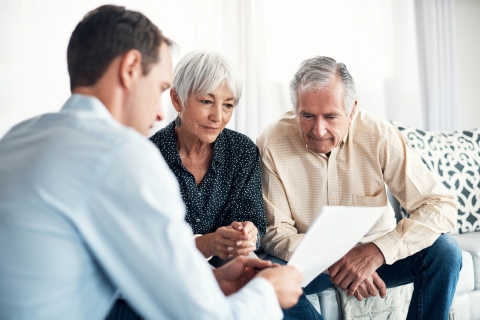 three people discuss plans